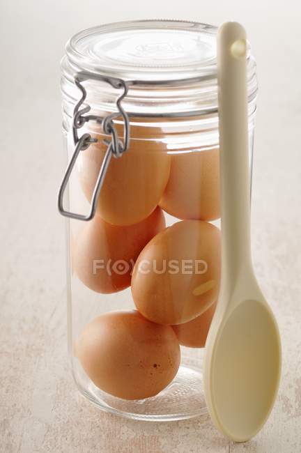Jar of raw eggs — Stock Photo