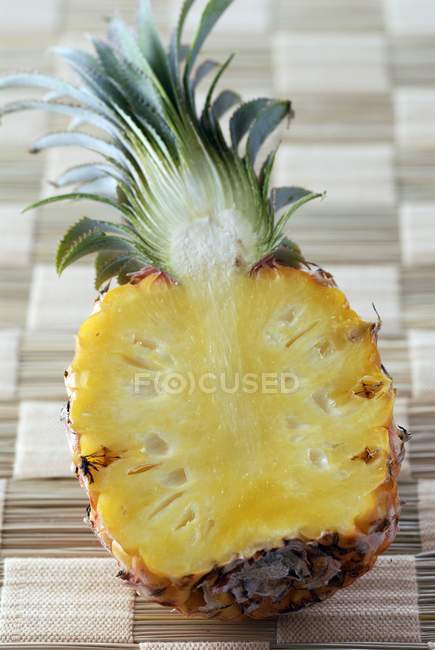 Fresh pineapple cut in half — Stock Photo