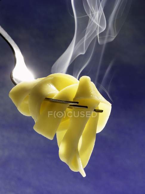 Steaming Cooked tagliatelle pasta — Stock Photo
