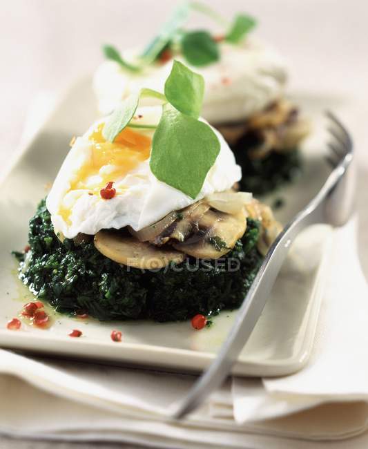Meurette eggs on white plate with fork — Stock Photo