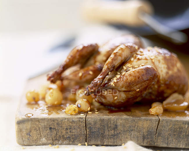 Quail with grapes and seeds — Stock Photo