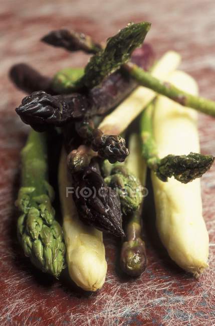 White with green and purple asparagus — Stock Photo