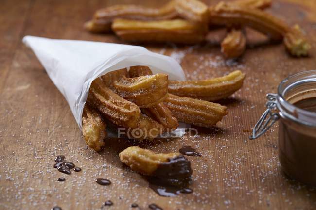 Closeup view of Churros with chocolate and sugar — Stock Photo