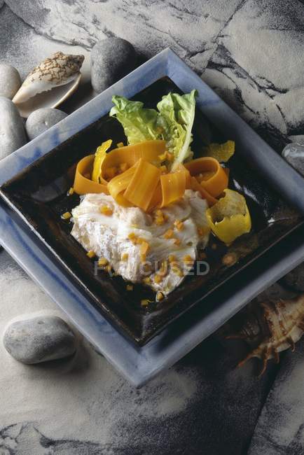 Fish and chips with flower salad — Stock Photo