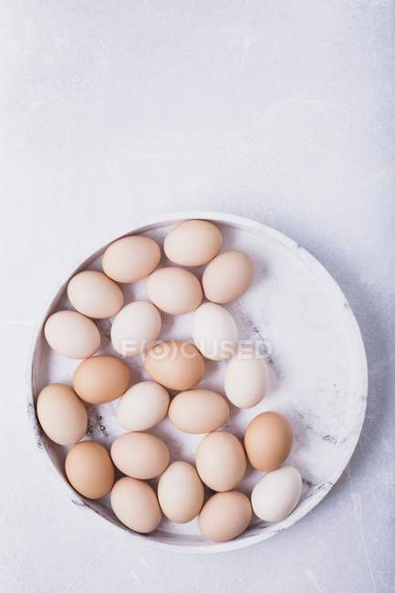 Eggs on a grey marble tray — Stock Photo