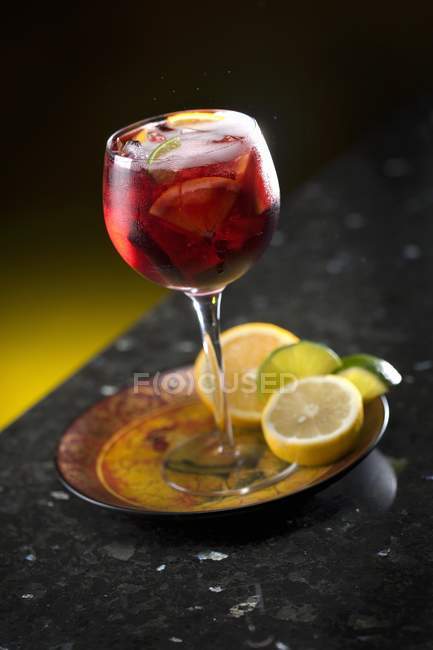 Sangria in a glass with citrus fruits — Stock Photo