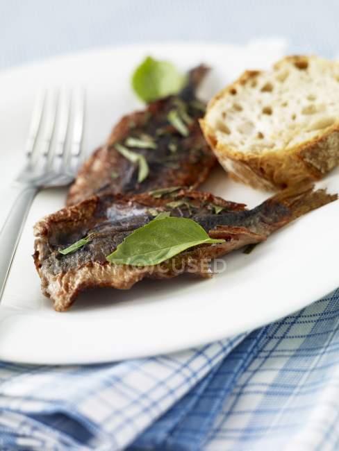 Escabche sardines on plate — Stock Photo