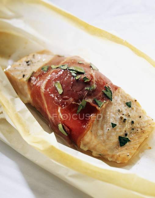 Salmon wrapped in raw ham — Stock Photo