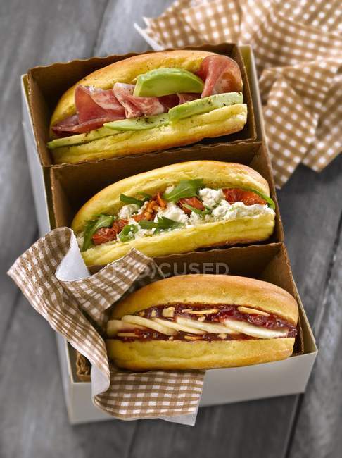 Three sandwiches in box — Stock Photo