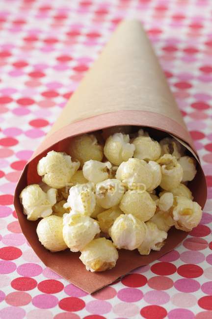 Paper cone of popcorn — Stock Photo