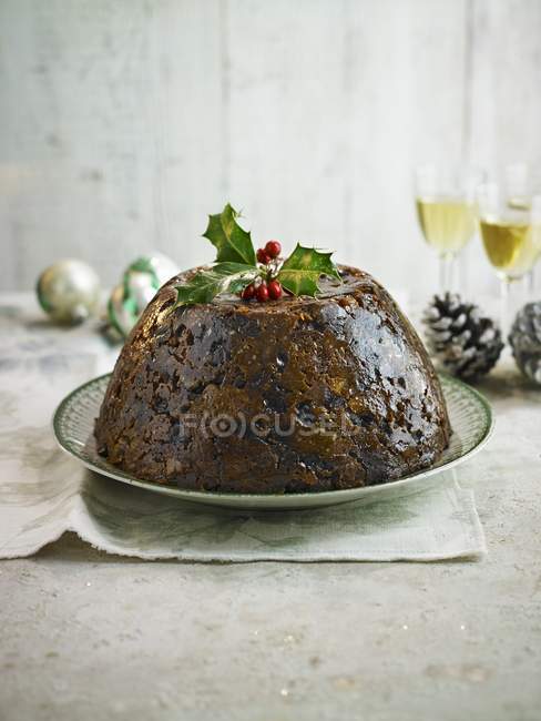 Christmas Pudding with holly — Stock Photo