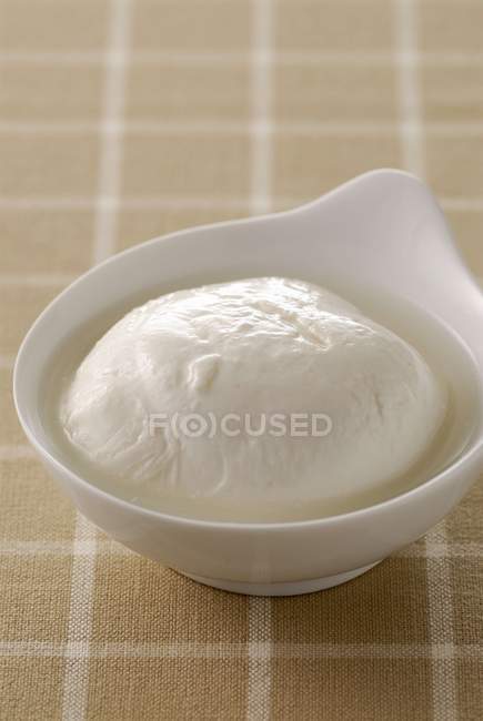 Mozzarella in white bowl — Stock Photo