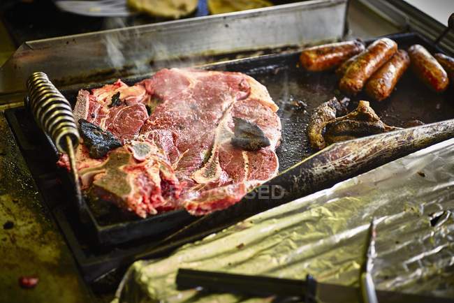 Ribeye steak on grill — Stock Photo