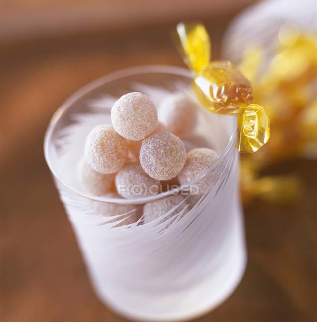 Honey candy in glass jar — Stock Photo
