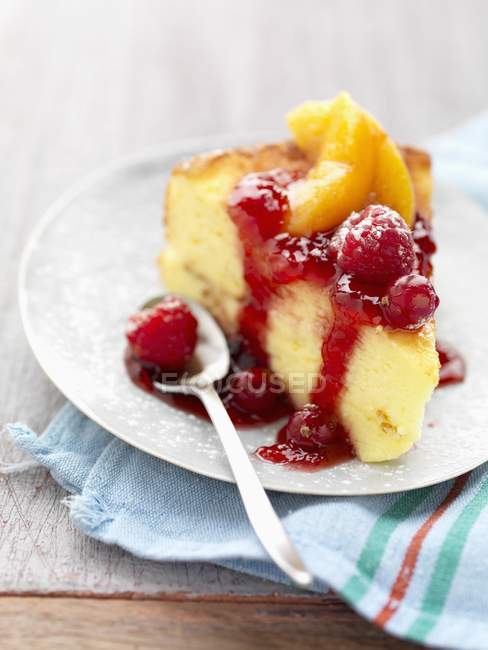 Soft cake with stewed summer fruit — Stock Photo