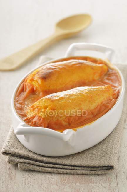 Closeup view of oven-baked Quenelles in baking dish — Stock Photo