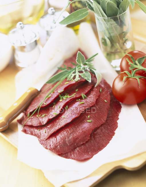 Raw steaks on towel — Stock Photo