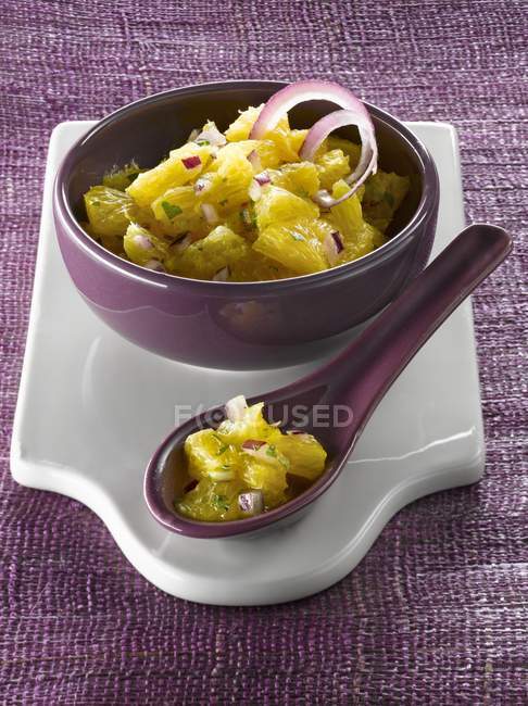 Coriander salad in purple bowl — Stock Photo