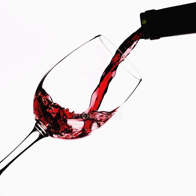 Pouring red wine — Stock Photo