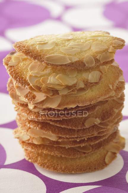 Sliced almond tuiles stacked — Stock Photo