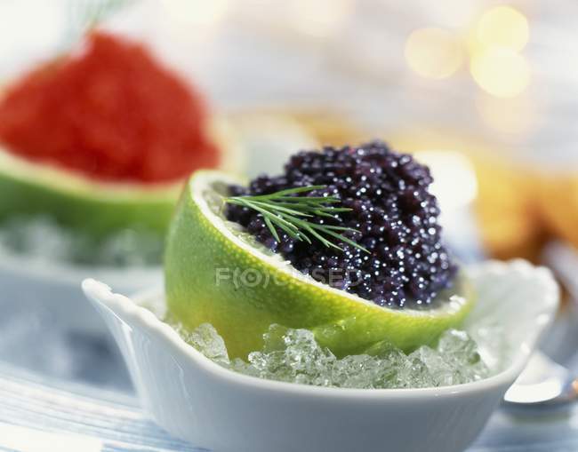 Closeup view of lime filled with lumpfish roe — Stock Photo