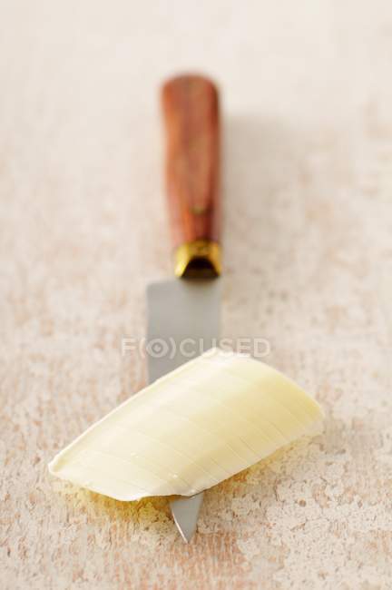 Stück Butter auf dem Messer — Stockfoto