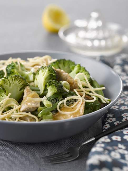 Sliced veal with broccolis and spaghetti pasta — Stock Photo