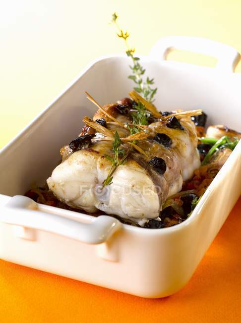 Roasted monkfish in baking dish — Stock Photo