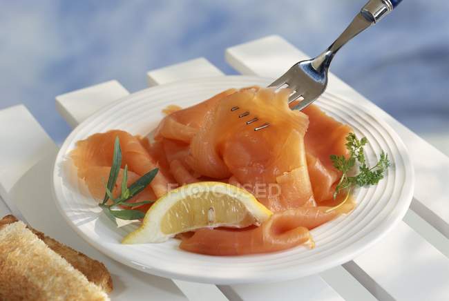 Sliced smoked salmon — Stock Photo