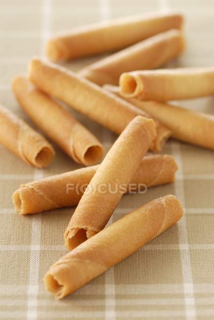 Rolled biscuits on tablecloth — Stock Photo