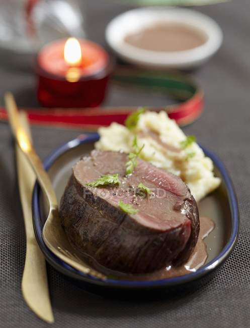 Roast bison with sauce — Stock Photo