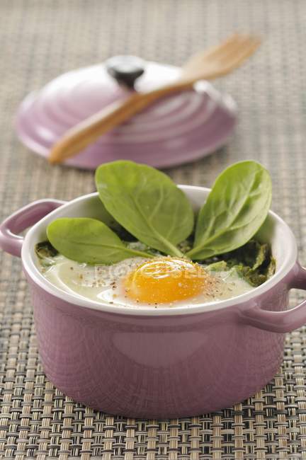 Coddled egg with spinach — Stock Photo