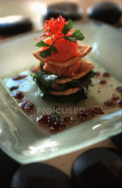Layered tartlet with salmon — Stock Photo