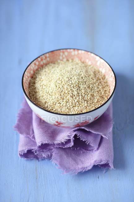 White sesame seeds in bowl — Stock Photo