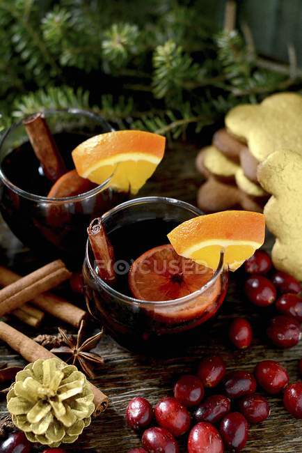 Glasses of Mulled wine with cinnamon sticks — Stock Photo