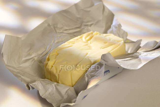 Open pat of butter — Stock Photo