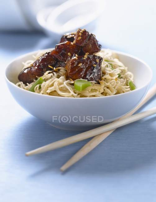 Rice noodles with caramelized pork — Stock Photo
