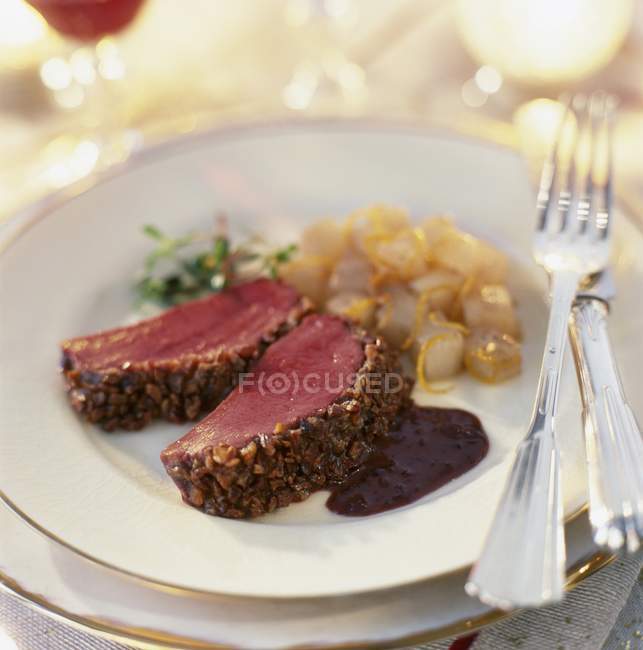 Closeup view of crunchy venison fillets with chestnuts — Stock Photo