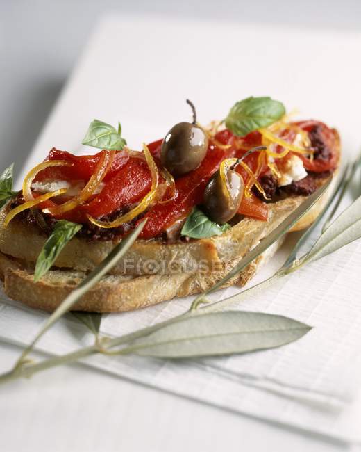 Tapenade and peppers on toast — Stock Photo