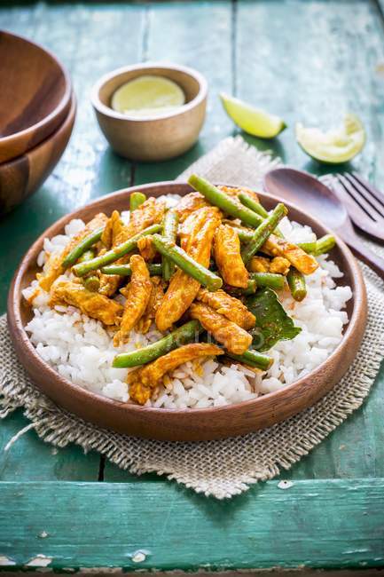 Spicy chicken with beans on rice — Stock Photo