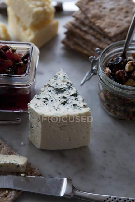 Blue cheese on grey surface — Stock Photo