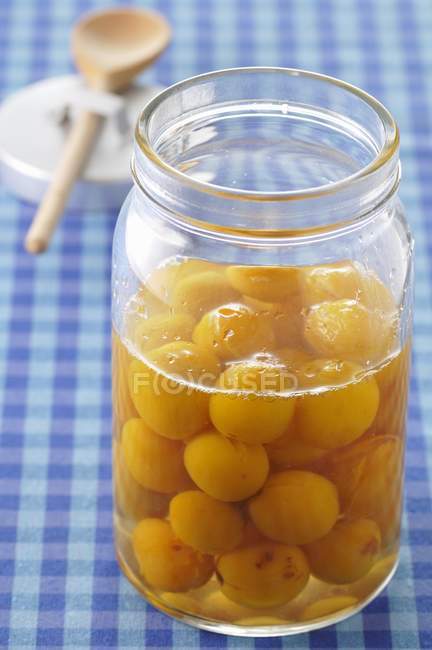 Mirabelle plums in syrup — Stock Photo
