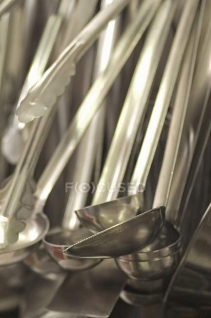 Closeup view of hanging cooking implements — Stock Photo
