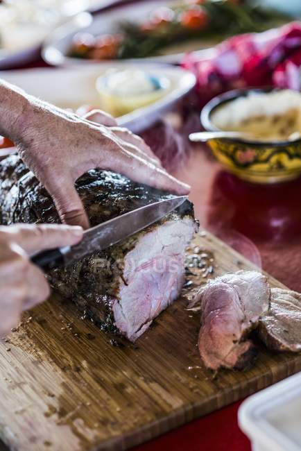 Neck of pork being cut — Stock Photo