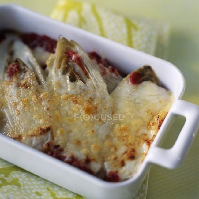 Chicory and tomato gratin — Stock Photo