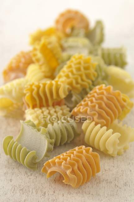 Dry uncooked colored radiatori pasta — Stock Photo