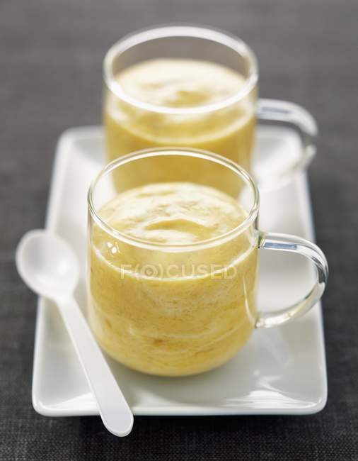 Mango yogurt in glass jar — Stock Photo