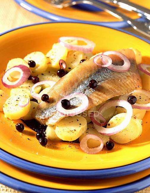 Marinated herring in oil with potatoes — Stock Photo