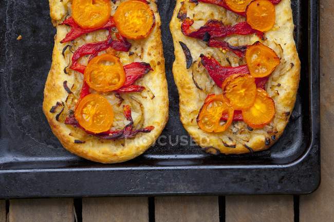 Focaccia with tomatoes and pepper — Stock Photo