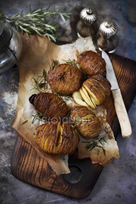 Baked potatoes with rosemary — Stock Photo